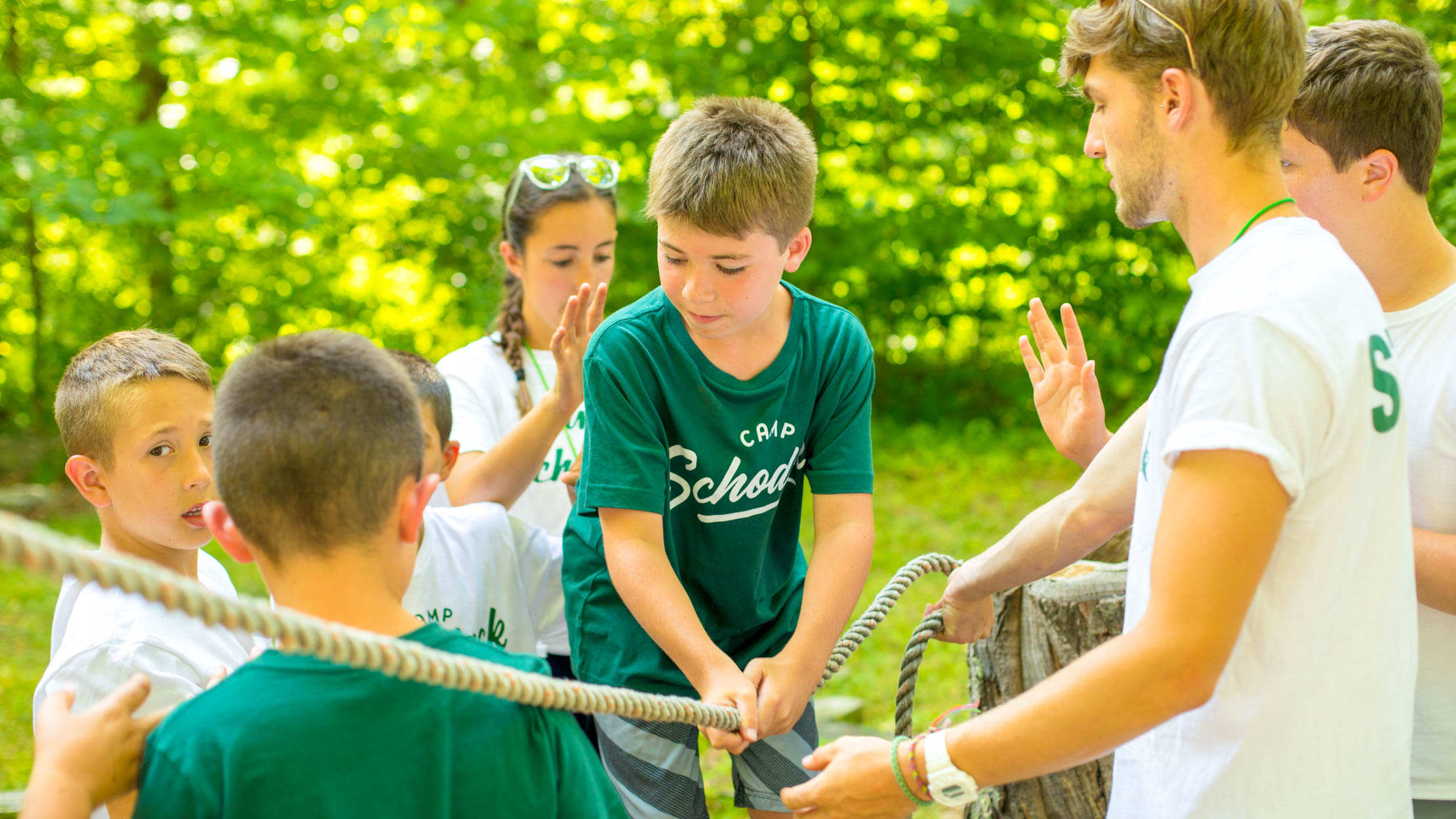 Group of boys does low ropes course