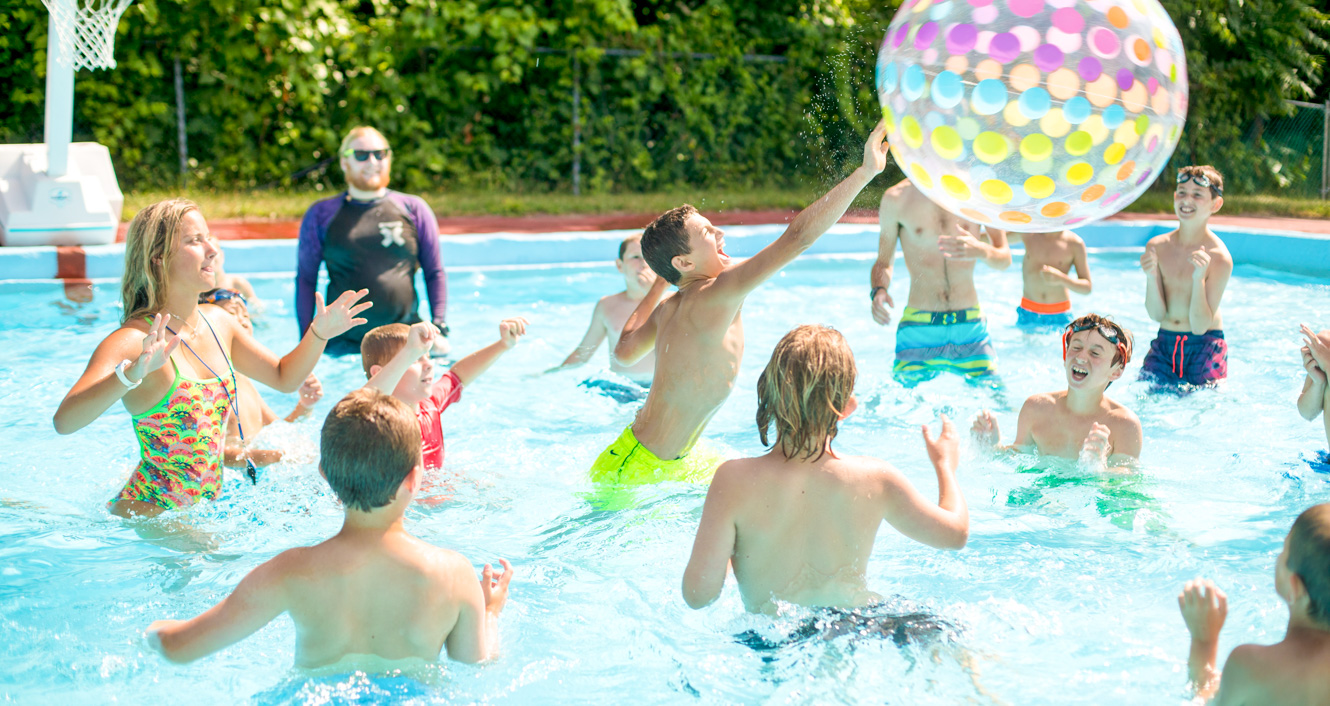 Group of campers having a pool party