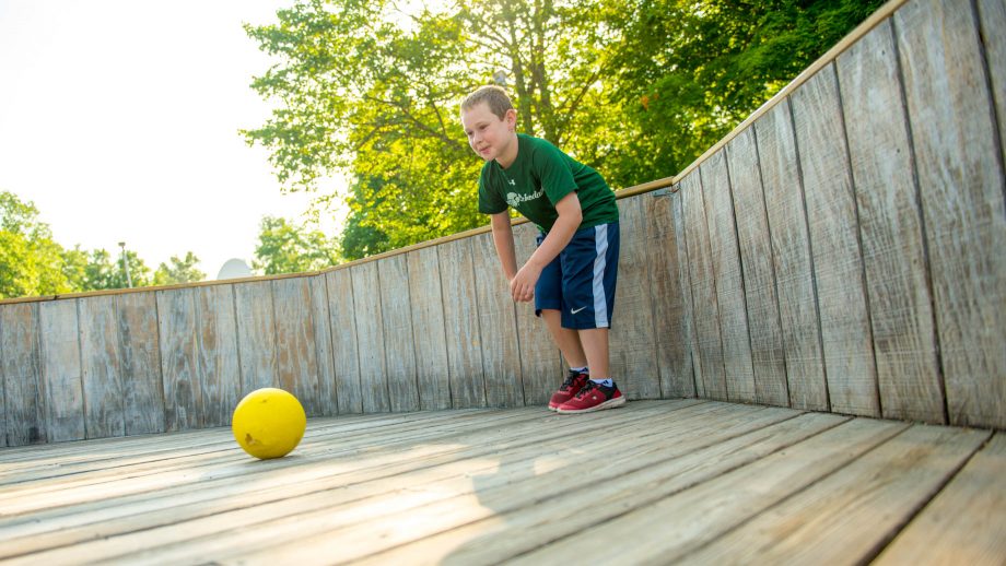 Boy plays GaGa at summer camp