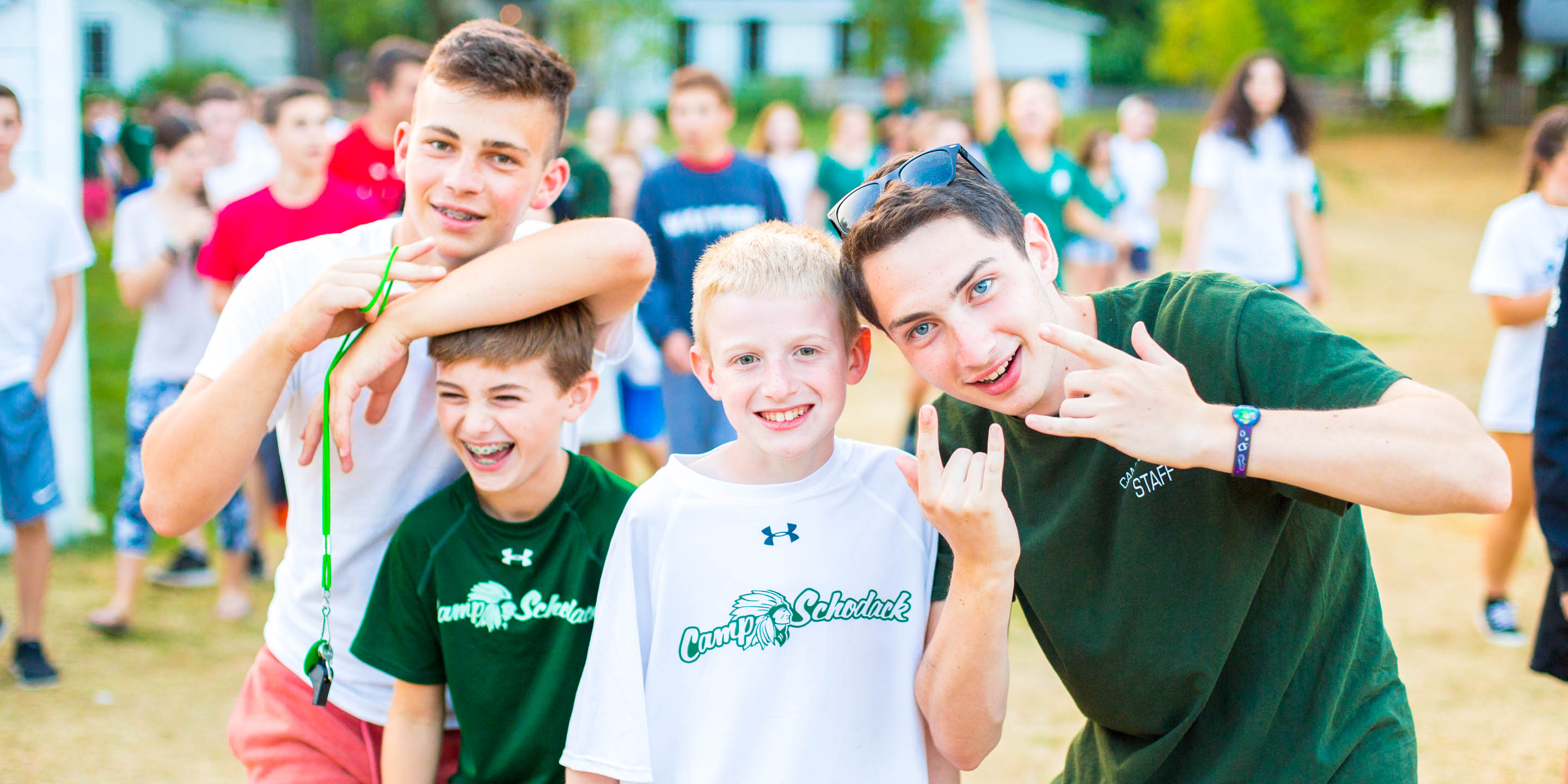 Staff members and campers do a silly pose for the camera